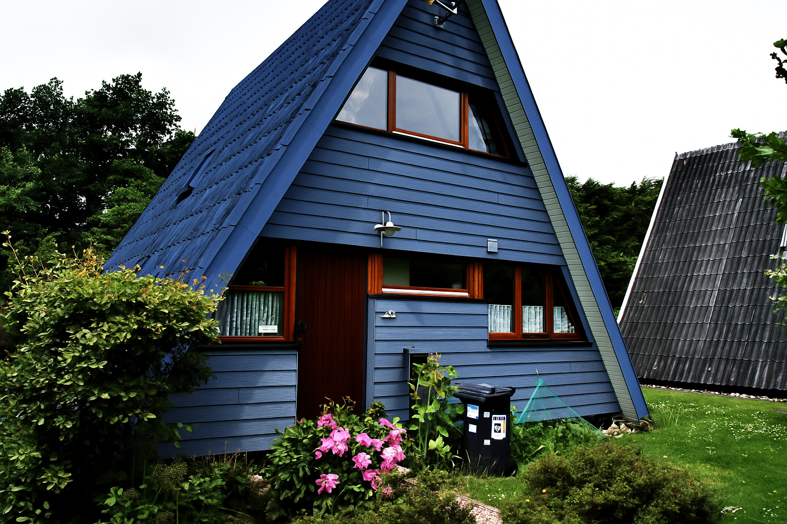 Ferienhaus Damp – A-Frame Haus im skandinavischen Stil Gemütliches A‑Frame-Ferienhaus in Damp mit gepflegtem Garten und skandinavischem Design